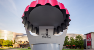 Exterior World of Coca-Cola with red cap bottle top