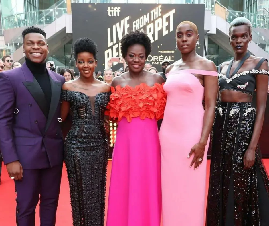 Cast of The Woman King movie in red carpet dresses; Viola Davis, John Boyega